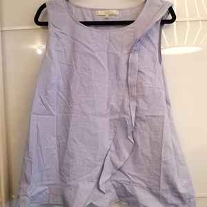 Blue and white stripped sleeveless blouse with ruffles Meghan Markles collection